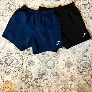 Two Pair of Men’s Arrival 5” Shorts. New condition. Size Small. Navy and Black.